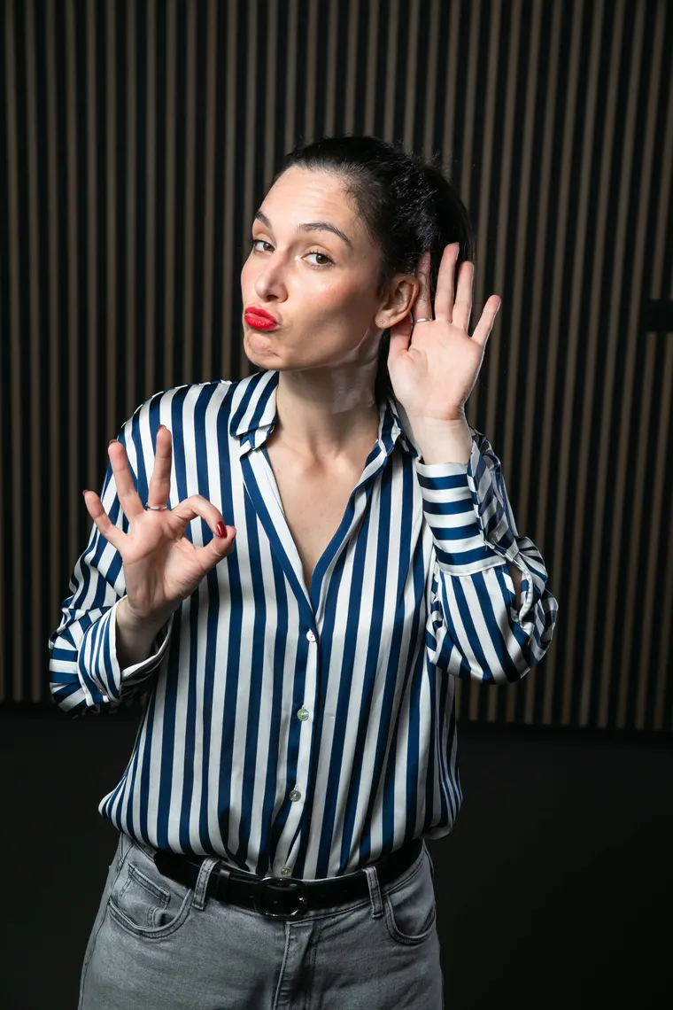 Tess making an OK gesture